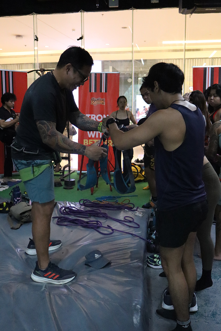 Coach Jao explaining climbing gear functions